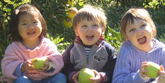 children holding apples
